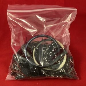560 grams of black costume jewelry grab bag